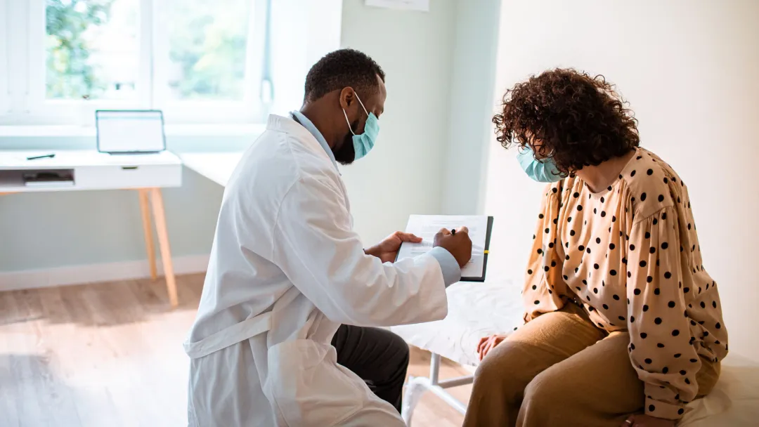 Provider and patient wearing masks in an office