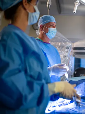 Neuro surgeon performing a procedure using a C-Arm.