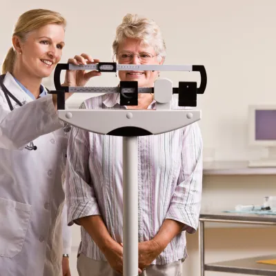 Woman on a scale at a doctor's office