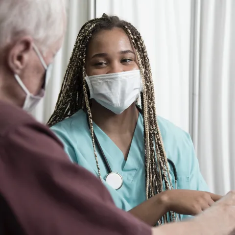 A man reviewing his test results on a tablet.