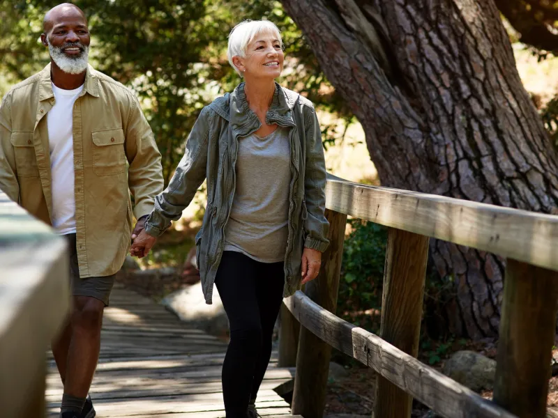 A couple on an outdoor walk together.