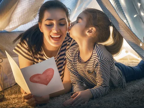 Mother and daughter laughing