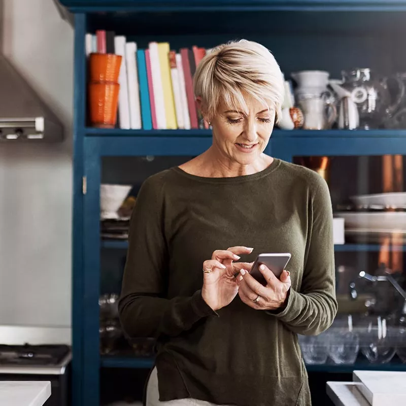 Woman typing on a smartphone